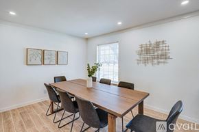 Dallas house for rent - A dining room with a wooden table and chairs.