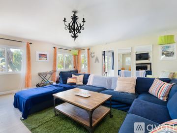 El Segundo apartment for rent - A living room with a blue couch and a wooden coffee table.