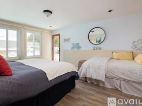 El Segundo apartment for rent - A bedroom with two beds and a mirror on the wall.
