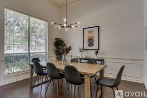 Plano house for rent - A dining room with a table and chairs.
