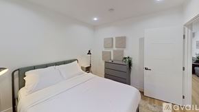 Los Angeles apartment for rent - A bedroom with a bed, nightstand, and lamp.