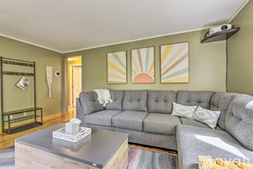 Granby apartment for rent - A living room with a grey couch and a coffee table.