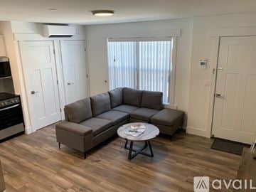 Rocky Point apartment for rent - A living room with a grey sofa and a coffee table.