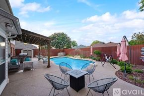 Haltom City house for rent - A backyard with a pool and patio furniture.