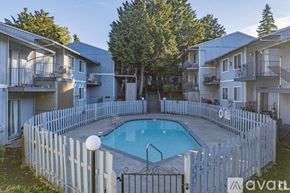 Portland apartment for rent - A small pool surrounded by a white picket fence.