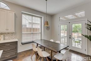 Mesquite house for rent - A dining room with a wooden table and chairs.