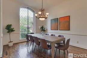 Dallas house for rent - A dining room with a wooden table and chairs.