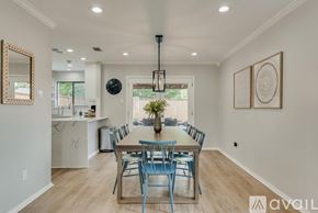Plano house for rent - A dining room with a table set for six.