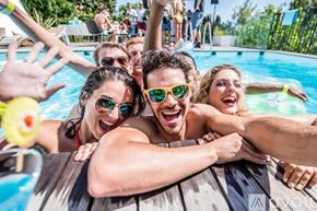 La Quinta condo for rent - A group of people are enjoying their time in a pool.