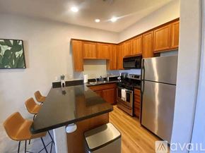 La Quinta condo for rent - A kitchen with wooden cabinets and stainless steel appliances.