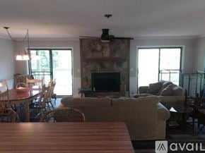 Dillard house for rent - A living room with a fireplace and a couch.