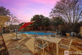 Plano house for rent - A backyard with a pool and patio furniture.