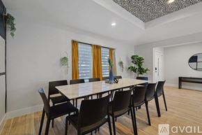 Plano house for rent - A dining room with a table and chairs.