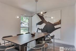 Dallas house for rent - A dining room with a wooden table and chairs.
