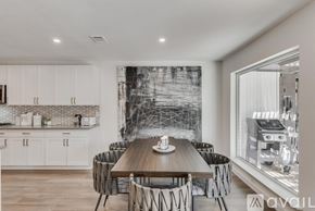Dallas house for rent - A modern kitchen with a dining table set for six.