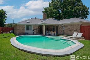 Richardson house for rent - A house with a pool in the backyard.