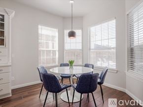 Mckinney house for rent - A dining room with a round table and chairs.
