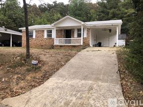 North Little Rock house for rent - A house with a driveway in front of it.