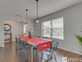 Garland house for rent - A dining room with a table set for six.