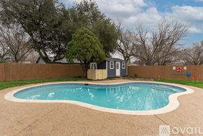 North Richland Hills house for rent - A small pool with a concrete border and a small building next to it.