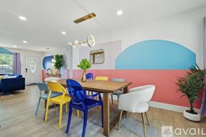 Dallas house for rent - A dining room with a wooden table and chairs.