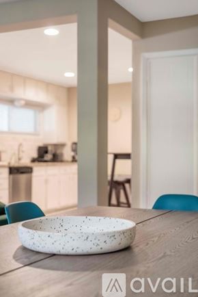 Irving house for rent - A bowl with a speckled pattern sits on a wooden table in a modern kitchen.