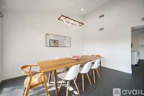 Grand Prairie house for rent - A modern dining room with a wooden table and chairs.