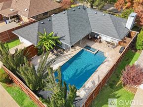 Allen house for rent - A backyard with a pool and a patio area.
