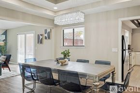 Allen house for rent - A dining room with a table and chairs.