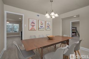 Dallas house for rent - A dining room with a wooden table and chairs.