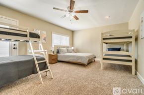 Dallas house for rent - A bedroom with two bunk beds and a single bed.