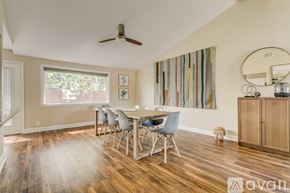 Dallas house for rent - A dining room with a wooden table and chairs.