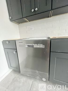 Schiller Park apartment for rent - A kitchen with a stainless steel dishwasher and a website address on it.