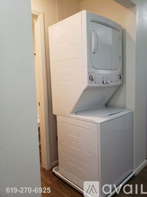 El Cajon apartment for rent - A white microwave oven is on top of a white dishwasher.