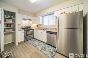 Clearwater apartment for rent - A kitchen with a refrigerator, oven, and sink.