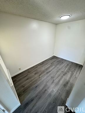 Azusa condo for rent - A bedroom with a large bed and a window.