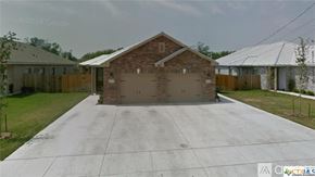 New Braunfels house for rent - A house with a garage in front of it.