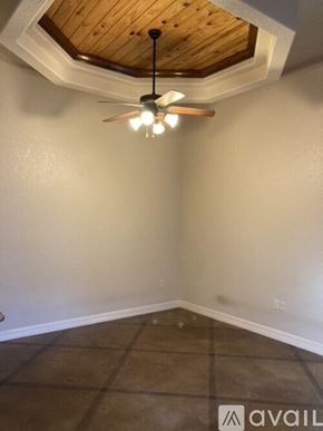 New Braunfels house for rent - A room with a ceiling fan and tile flooring.