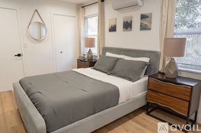 Los Angeles apartment for rent - A bedroom with a bed, nightstand, and lamp.