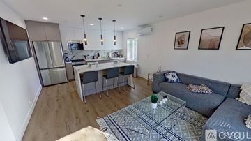 Los Angeles apartment for rent - A modern living room with a grey couch and a coffee table.