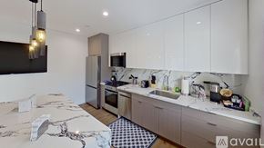 Los Angeles apartment for rent - A modern kitchen with a marble table and a sink.