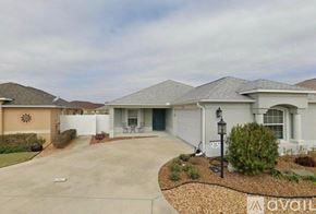 The Villages house for rent - A house with a driveway and a sign that says "available".