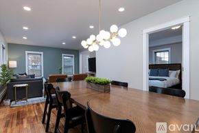 Rutland house for rent - A modern dining room with a wooden table and chairs.