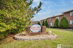 Johnson City townhouse for rent - A sign for Lori-Ann Townhomes is displayed in front of a building.