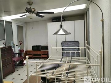 Laguna Woods condo for rent - A living room with a dining table and chairs.