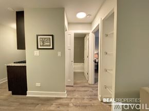 Chicago apartment for rent - A kitchen with a stainless steel refrigerator and oven.