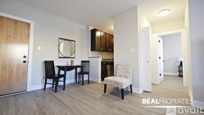 Chicago apartment for rent - A dining area with a table and chairs is shown in the image.