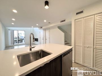 Chicago apartment for rent - A modern kitchen with a sink and a window.