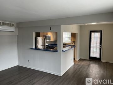 Highland Park apartment for rent - A kitchen area with a refrigerator, stove, and sink.