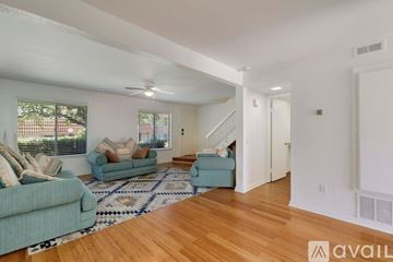 Carlsbad apartment for rent - A living room with a blue couch and a rug.